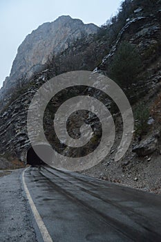 Road In A Tunnel Caught In The Rock Of A Gorge That Surrounds The Plandescun Reservoir A Rainy Day In Plan. Travel, Landscapes,