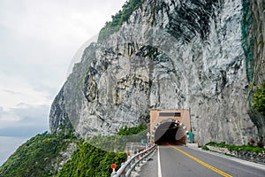 Road and tunnel in the rocks next to the Pacific coast on the east coast of Taiwan