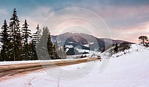 Road turnaround near the forest in snowy mountains