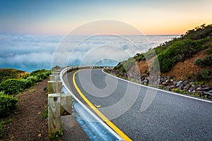 Road and view of fog over the San Francisco Bay