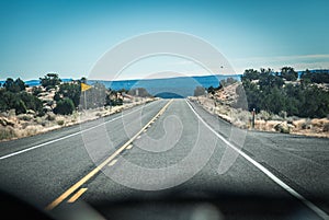 Road view from inside car behind console