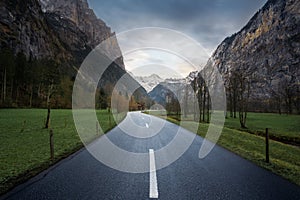 Road view leading straight into Bernese Alps Mountains - Lauterbrunnen, Switzerland