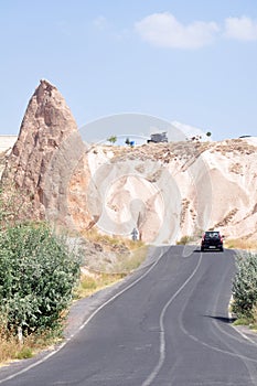 Road view of rock formations in Devrent Valley, Cappadocia, Turkey