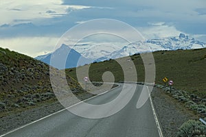 Road view with snowed mountains from Chalten, Argentina photo