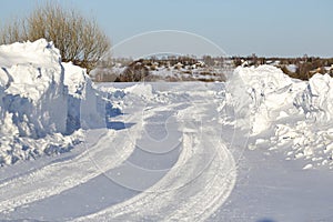 Road on which there are ruts from cars on the roadway