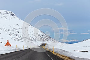 Road winding through snowy mountain pass scenery