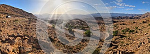 A road winding up a mountain in a great mountain landscape in the Anti-Atlas