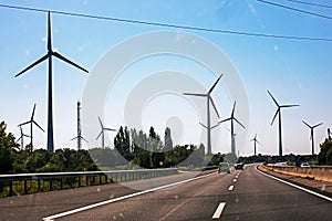 road through windmills. Energy saving. Global energy crisis. l