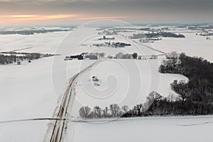 Road Into Winter Landscape of Farms Fields and Forests