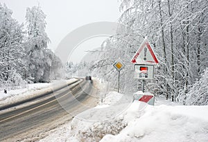 Road through wintry forest photo