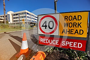 Road work ahead reduce speed 40 KM/H speed limited zone safety warning sign