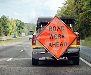 ROAD WORK AHEAD Sign Mounted on Rear of Truck