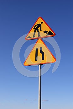 Road work and narrowing signs