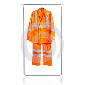 Road worker form clothing on hanger rack
