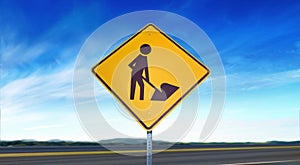 Road Workers Ahead Symbol - Yellow Road Sign Isolated on Sky Background with Room for Copy