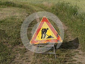 Road working sign on country road