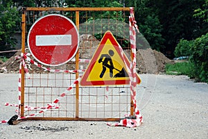 Road works caution signs. No thoroughfare. Trespassing, prohibited