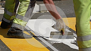 road works. painting of a pedestrian crossing. Road repair industry asphalt construction traffic transport