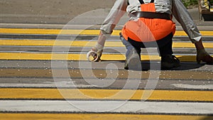 road works. painting of a pedestrian crossing. Road repair industry asphalt construction traffic transport