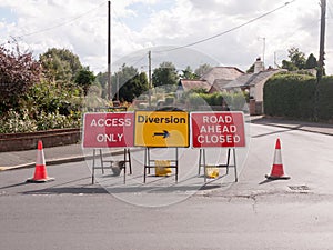 Road works road blocked signs and traffic cones diversion access photo