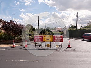 Road works road blocked signs and traffic cones diversion access photo