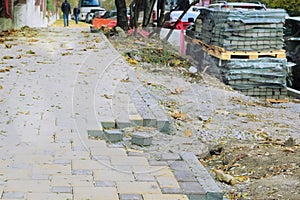 Road works on the sidewalk. Paving stone for repair