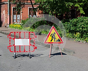 Road works sign for repairs in courtyard