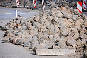 Road works. Stack with cobblestone, paving. Selective focus