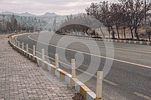 Road with yellow road marking at landscape of Cappadocia Turkey