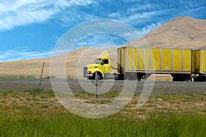 On the road, yellow truck in Colorado