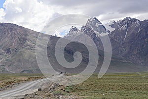 Road in Zanskar landscape view with Himalaya mountains covered with snow and blue sky in Jammu & Kashmir, India