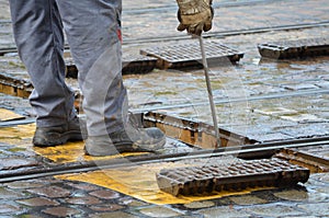 Roadman repairs streetcar rails