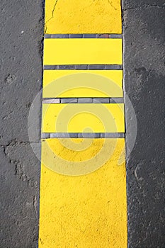 roadmark yellow line on asphalt top view