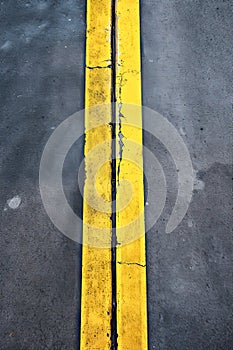 roadmark yellow line on asphalt top view
