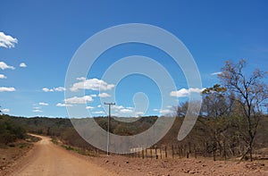 Roads in the rural area of northeastern Brazil that cuts through vegetation typical of the semi-arid area photo