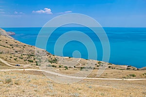 Roads and sea landscape at Cape Meganom, the east coast of the peninsula of Crimea. Colorful background, travelling concept.