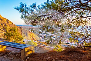 Roadside bench at Mesa Vouno mountain above Kamari village Santorini Greece