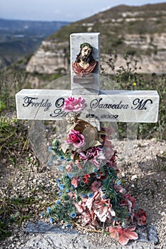 A roadside cross marks the spot where another life was claimed on the notoriously dangerous roads of Ecuador.