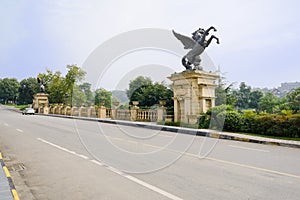 Roadside statue of flying horse in suny autumn