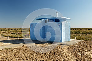 Roadside toilet on the highway in the steppe