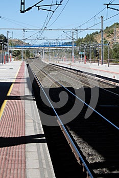 Roadside and train tracks in a station