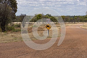 Roadside warning sign advising of unfenced animals.