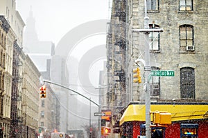 Roadsign at Broadway street in downtown Manhattan in New York City during massive winter snowfall