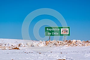 Roadsign Republica de Chile on the road with snow at the border with Bolivia