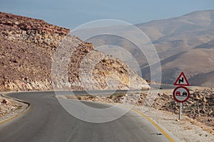 Roadsigns on desert road, Jordan