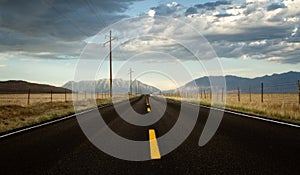 A roadway in a countryside with mountains