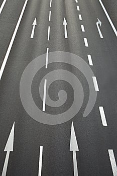 Roadway with road surface marking and arrows pointing straight