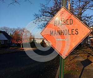 Roadwork in Residential Neighborhood, Raised Manholes Sign, New Jersey, USA