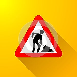 Roadwork sign on yellow background photo