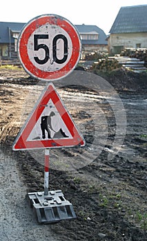 Roadwork and slowdown sign